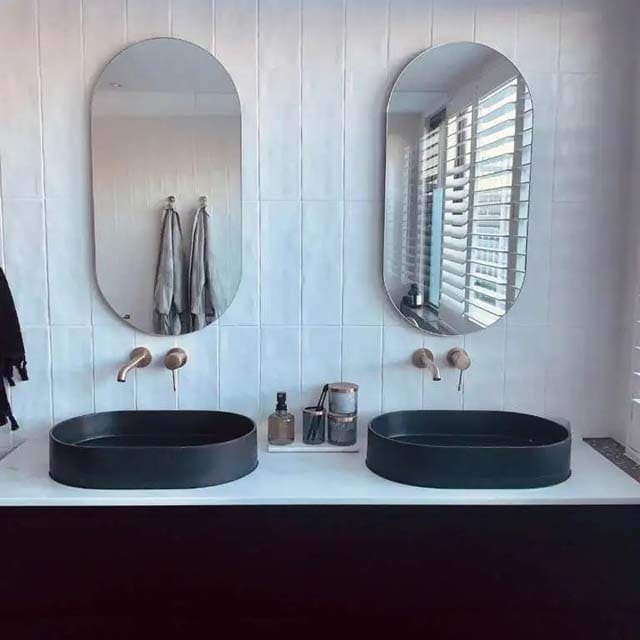 Oval decorative wall mirror installation in Dubai Abu Dhabi UAE